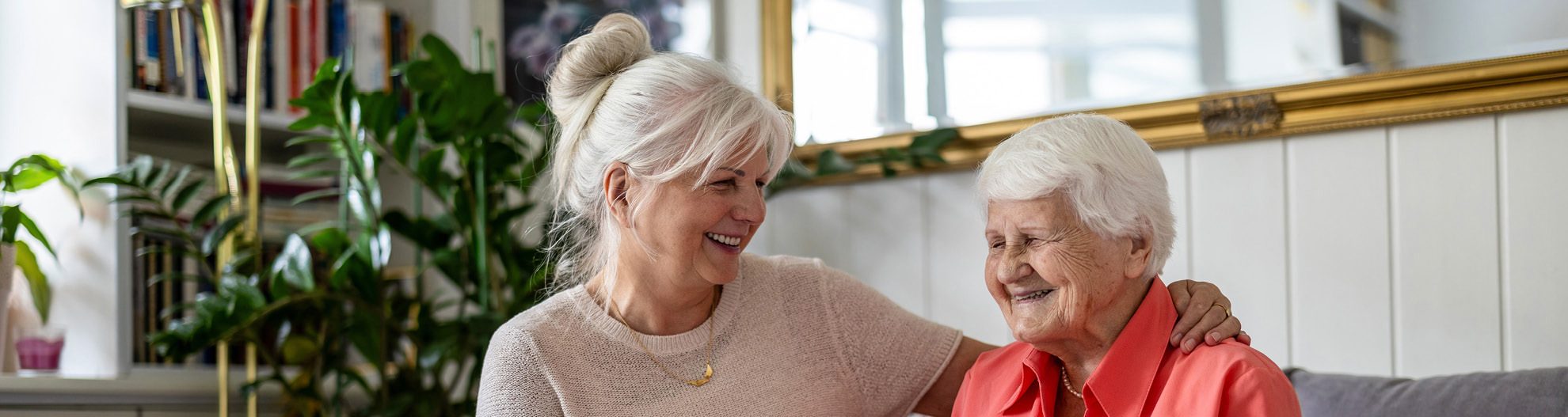 Senior woman sitting with her adult daughter