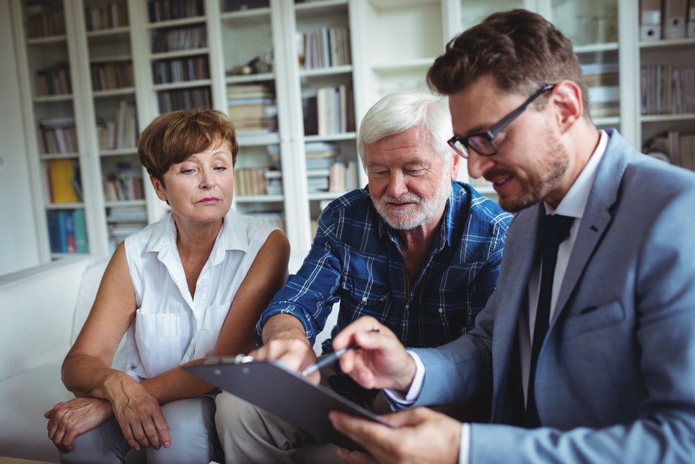 Advisor and elderly couple planning